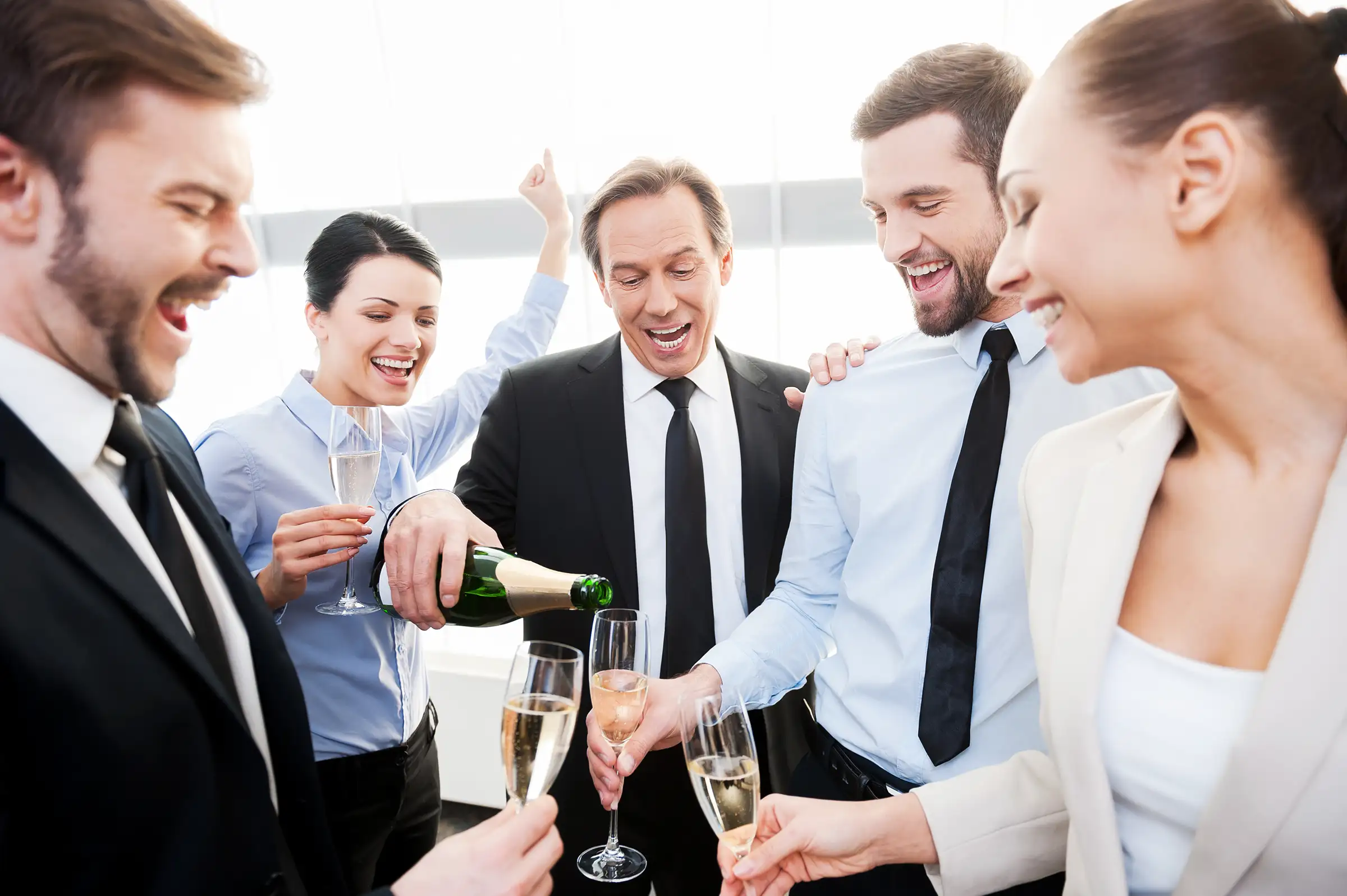 business colleagues celebrate with champagne at wo 2026 03 19 02 19 55 utc